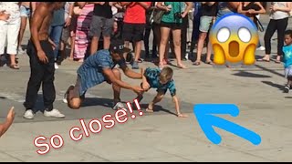 7 year old surprises street performers with a backflip