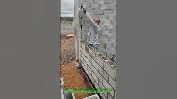 "Skilled Worker Builds Concrete Block Wall! 🧱 Precision & Speed in Masonry"