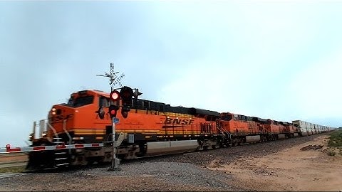 BNSF Intermodal Train Cruising Through The Great Plains Of Texas