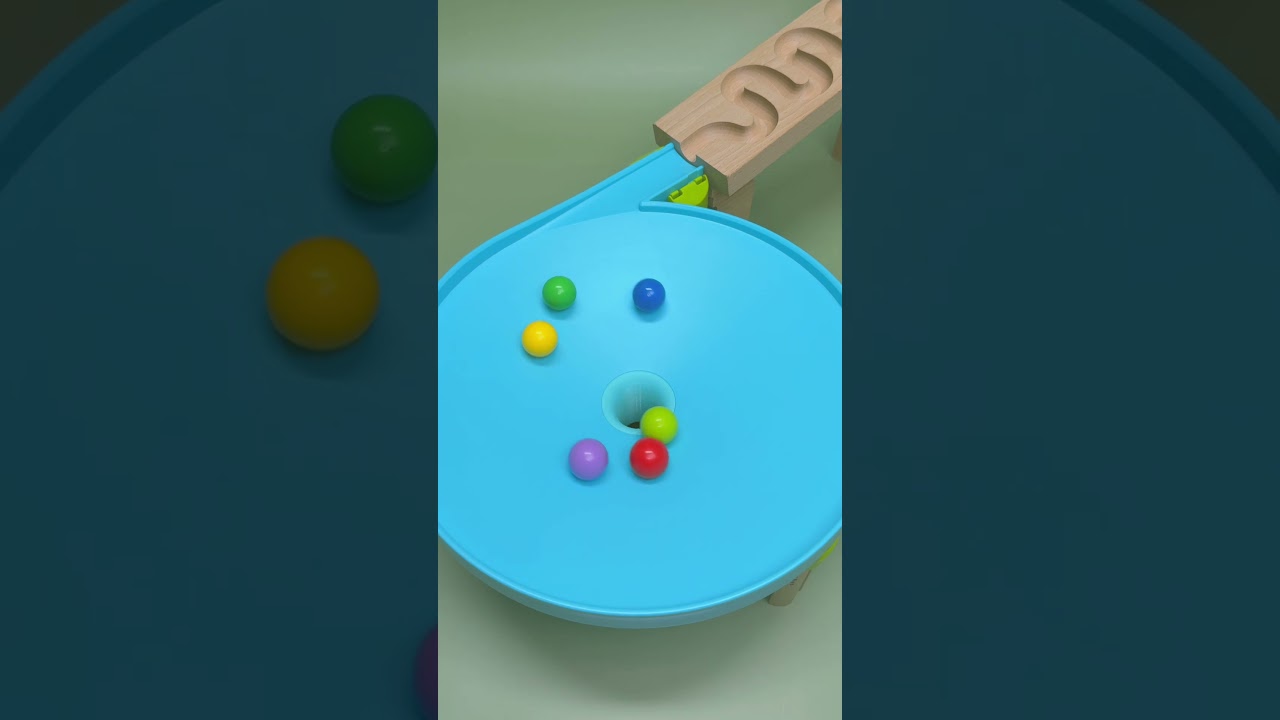 Colorful marbles are rolling into the hole. #satisfying