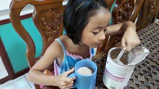 My little sister making her own drink: Appeton Weight Gain