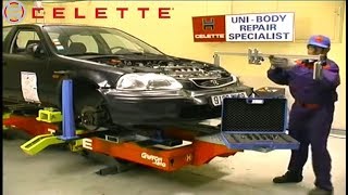 Honda Civic body repair on a Celette car frame machine, setup with universal jig, measuring system.