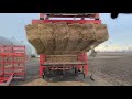 Loading a semi with small squares of straw with Steffens 18 bale grapple