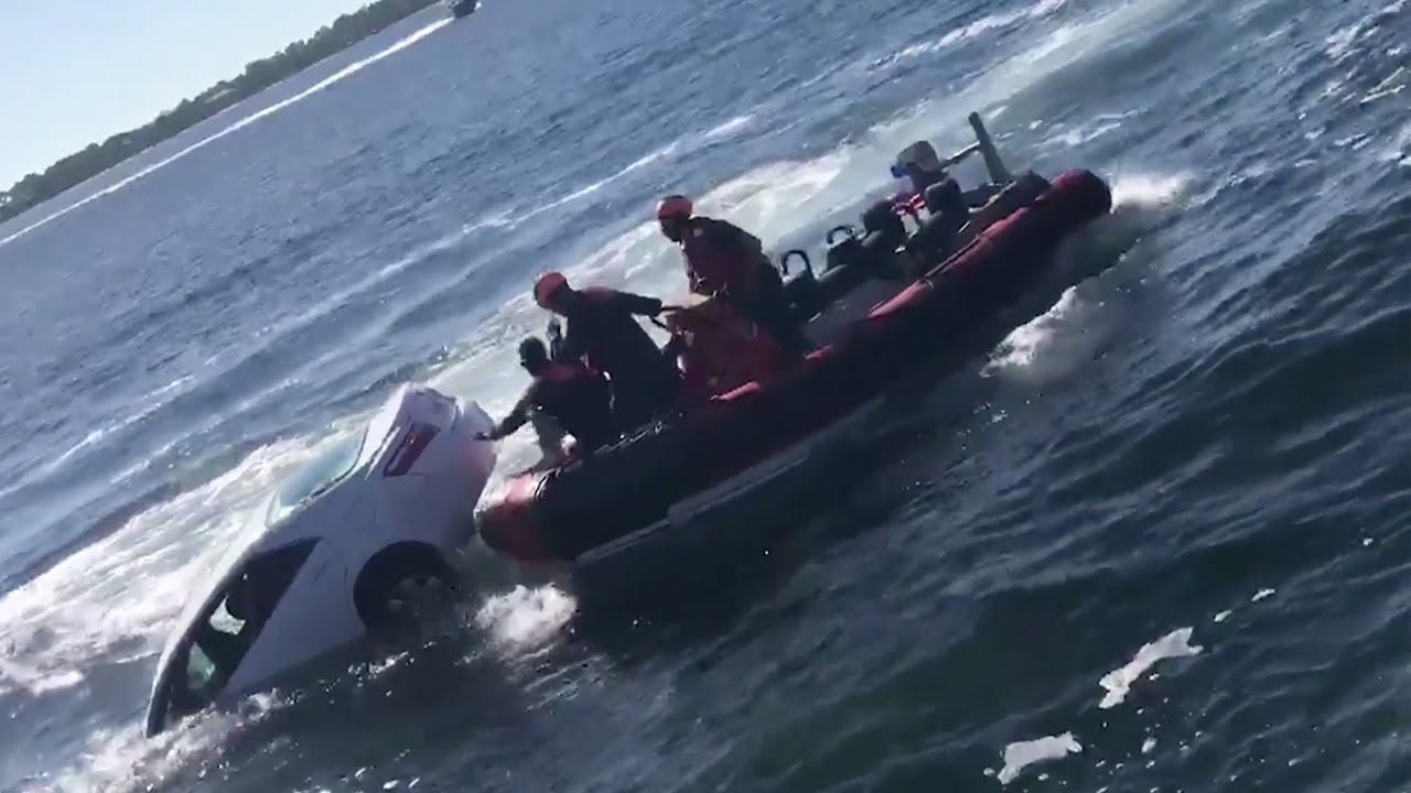 US Coast Guard rescues man from sinking car - YouTube