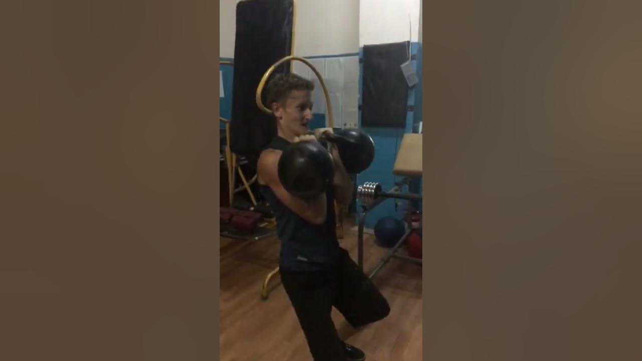Подъем двух гирь 24 кг