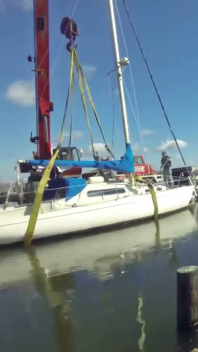 Crane Lifting Sailboat