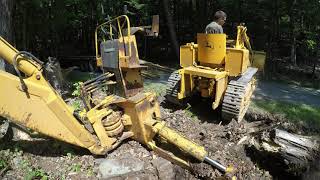 Moving a John Deere backhoe and breaking it