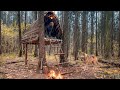 Built a cozy wooden shelter for survival in a cold forest! Bushcraft camping in the wild.