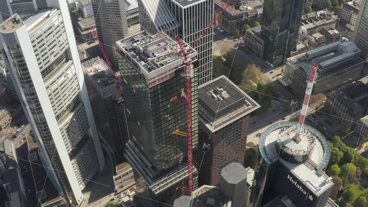 AERIAL: Super Close Up View of Skyscraper construction site in Urban ...