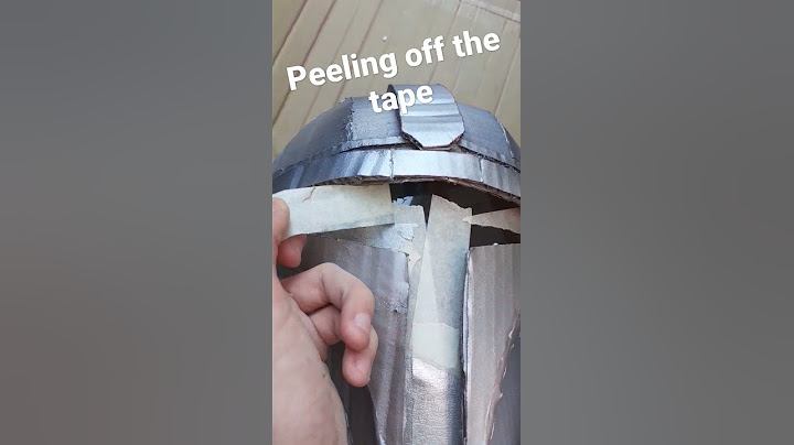 peeling off the tape from my cardboard mandolorian helmet