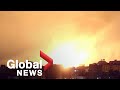 Rockets, explosions light up Gaza night sky amid escalating Mideast conflict