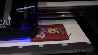 NC UV0609 digital uv led flatbed leather note book printing machine.