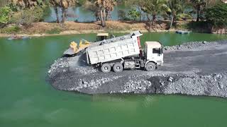 A project involving heavy machinery for clearing a fish pond  When reviewing original videos