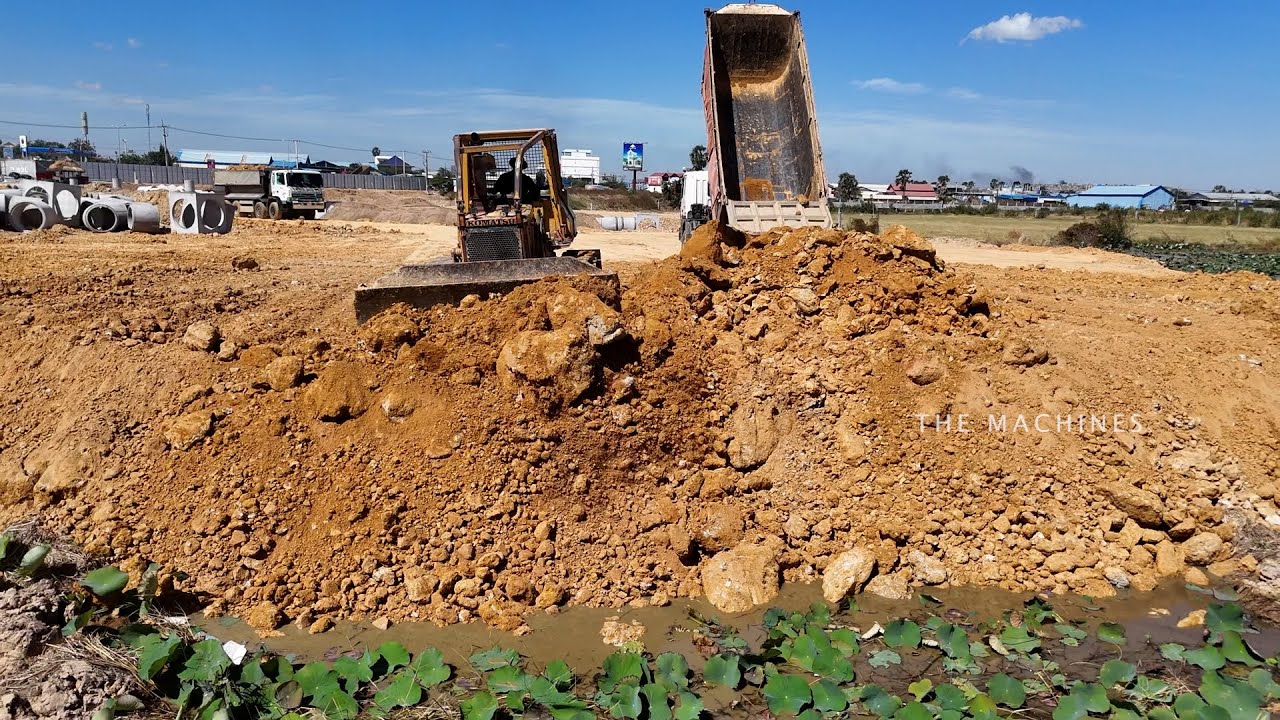 Awesome Land Filling Machine Operator Bulldozer Pushing Dirt, Dump Truck Unloading
