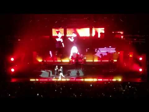 Logic brings up a fan to perform Flexicution on stage in San Francisco.