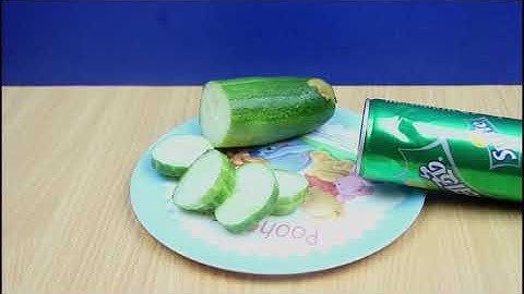 Chopping Cucumbers With Can Of Cola