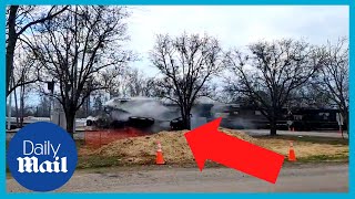 Unstoppable train crashes into truck lugging concrete beam
