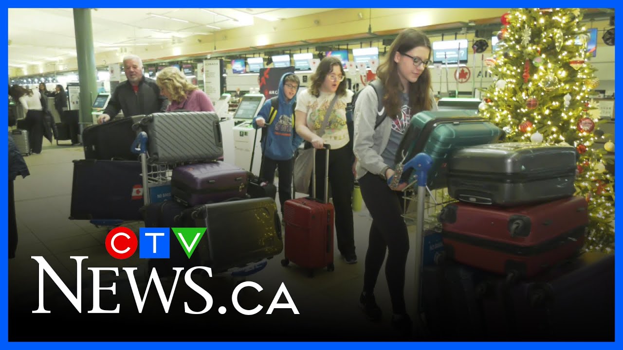 Busiest travel day of the year at Edmonton's airport - YouTube
