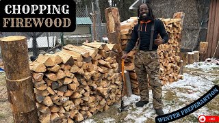 Chop firewood for winter storage Jamaican in the North