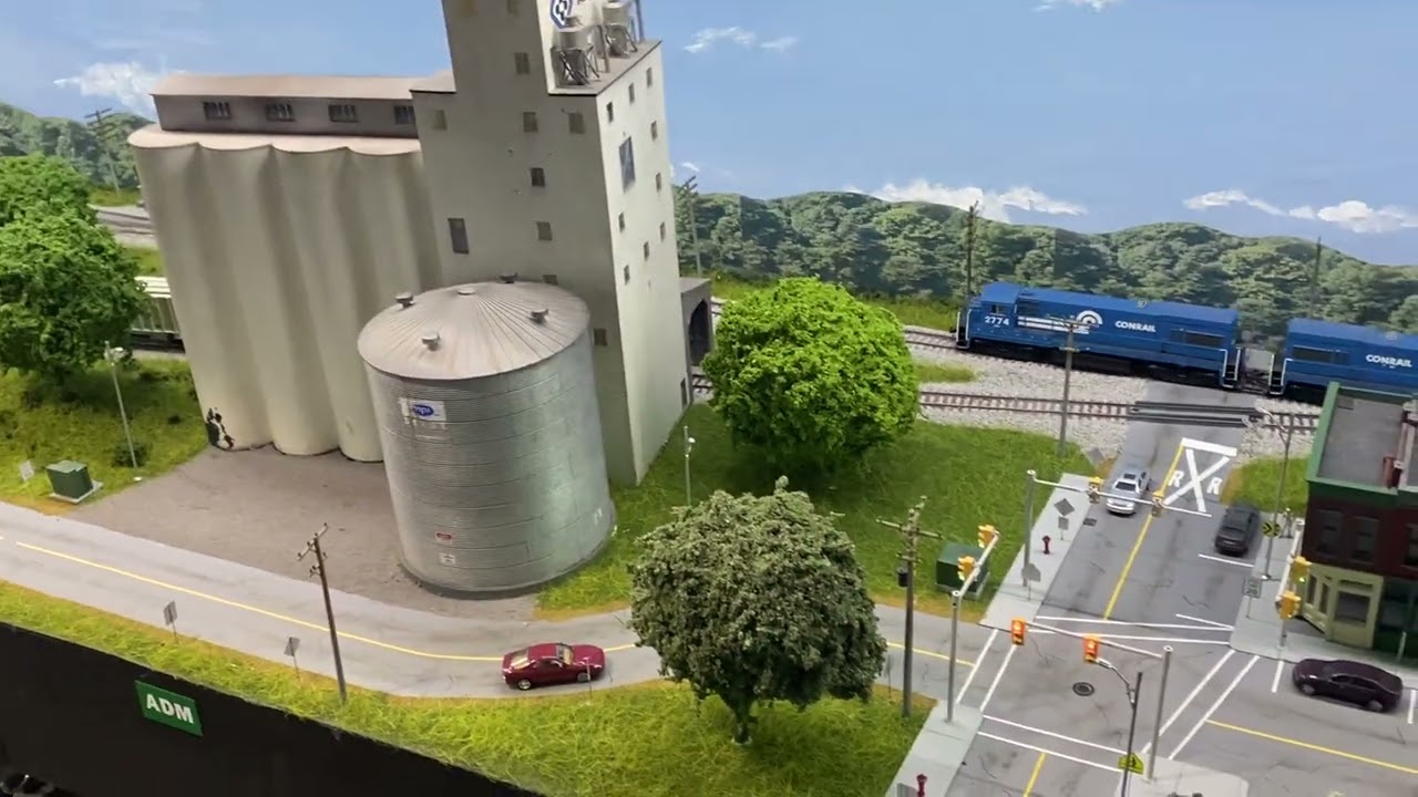 How about we follow the slab train from an aerial view around most of the layout.