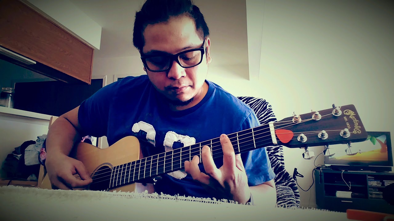 Martin Lx1e acoustic electric guitar. Plugged in to a Fender