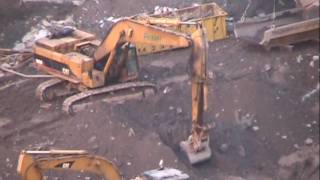 Cat 385BL Excavator loading out dirt