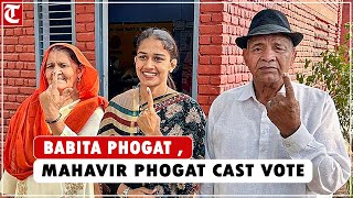 Wrestling coach Mahavir Phogat, Olympian Babita Phogat cast their vote in Charkhi Dadri