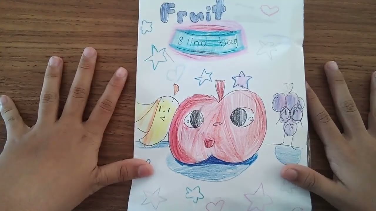 Me making a paper fruit blind bag