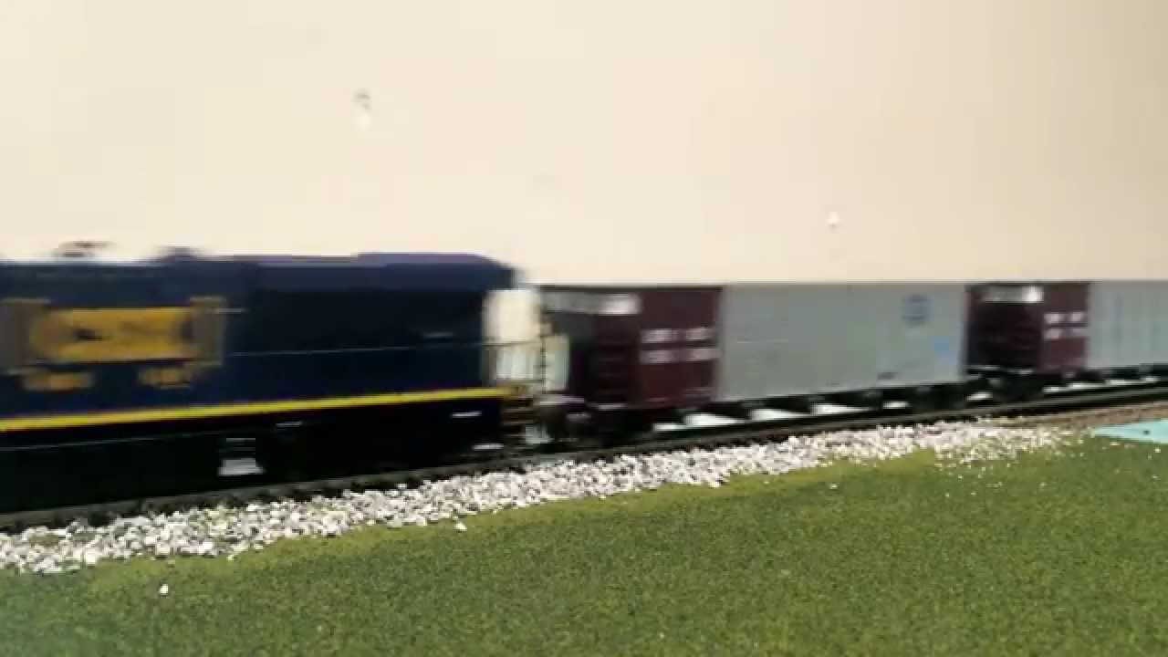 HO Scale CSX ES44AH leading a few coal cars. YouTube