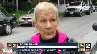 Baltimore police officer struck by carjacked vehicle