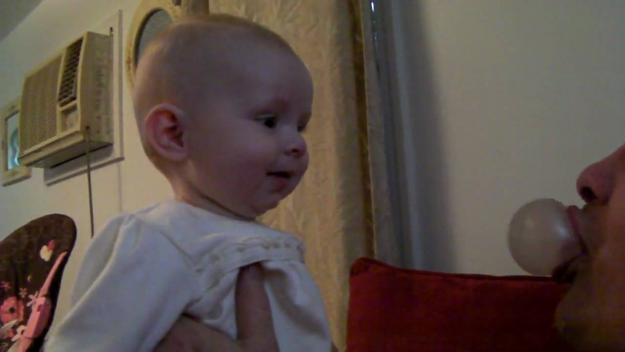 Audrey and her daddy... chewing gum bubbles, super cute!