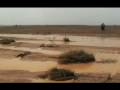 Two horsemen ride to the Sahara desert