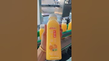 Orange juice bottle filling sealing labeling machine customized line video