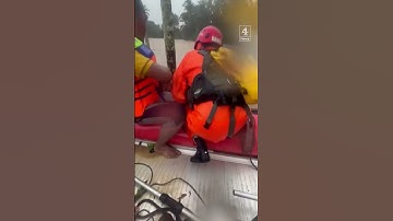 Two men clinging to trees rescued in deadly Indonesia floods