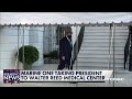 President Donald Trump walks to Marine One before heading over to Walter Reed