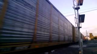UP 7732 leads a fast stack train through Ontario