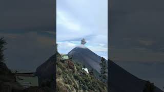 Guy Watching Fire Volcano Erupt from Nearby Camp