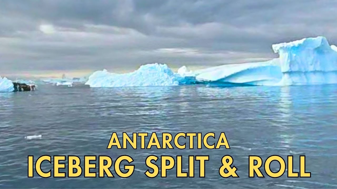 Small Iceberg Splits and Rolls Over | Antarctica Zodiac Experience