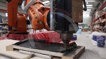 Trimming from CAD CAM with KUKA robot on 15m linear track - RAS Skordos