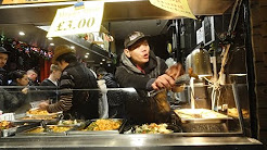 The famous Bang, Bang Chicken Man at Chinese Street Food shop in Camden Lock Village Market, London.