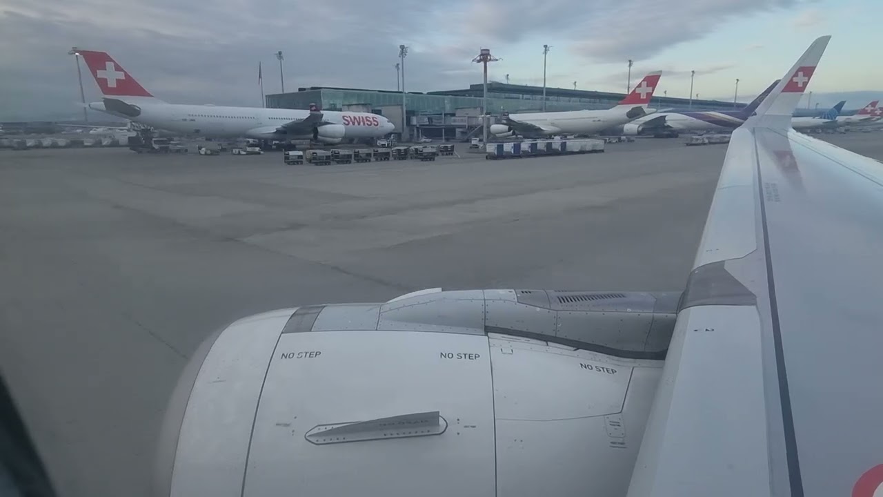 Swiss Airbus A320 engine and wingview landing at Zurich Airport {ZRH/LSZH} runway 14