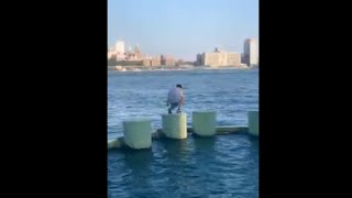 Parkour Athelets Jumping Over Tanks In A River