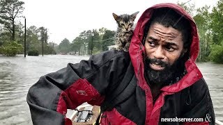 A man and his 'Survivor' kitten escape the floodwaters from Hurricane Florence