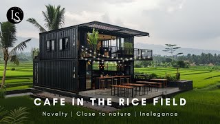 The black container cafe stands out amidst the emerald expanse of the rice field.