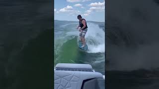 Surfing behind Nautique G23 Paragon