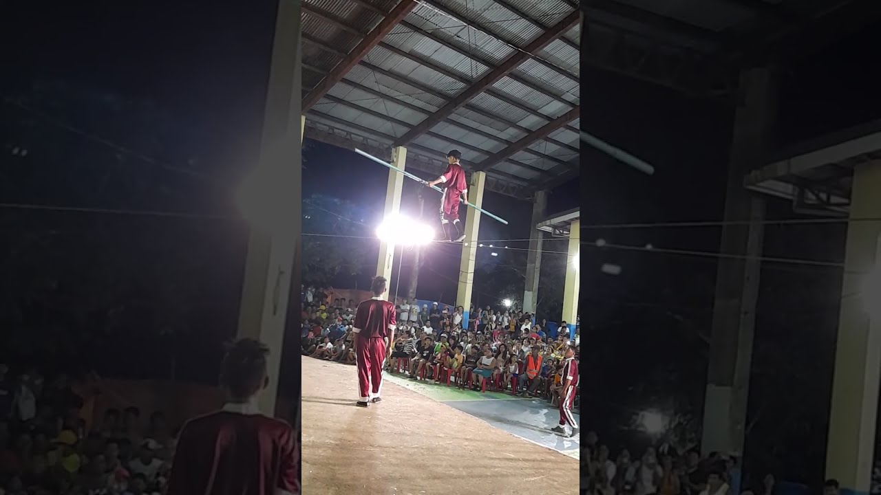 Acrobats show with highwire walker and bicycle act, 