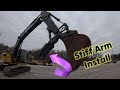 Install of a stiff thumb on a john deere 210g excavator