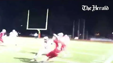 Thomas Spanos catches a pass for Carmel in its 54-...