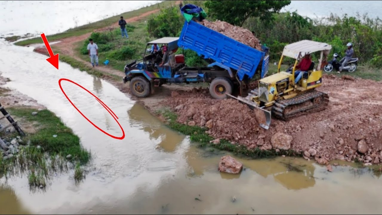 Wonderful Action Construction Building Road On The Flooded Area By Bulldozer D21P & Dump Truck Unloa