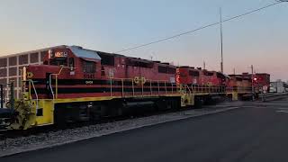 An early morning loaded rock train with GP38-2 and SD40-2 locomotives.